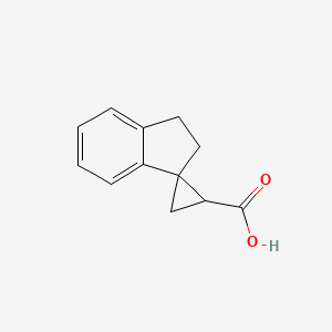 spiro[1,2-dihydroindene-3,2'-cyclopropane]-1'-carboxylic acid